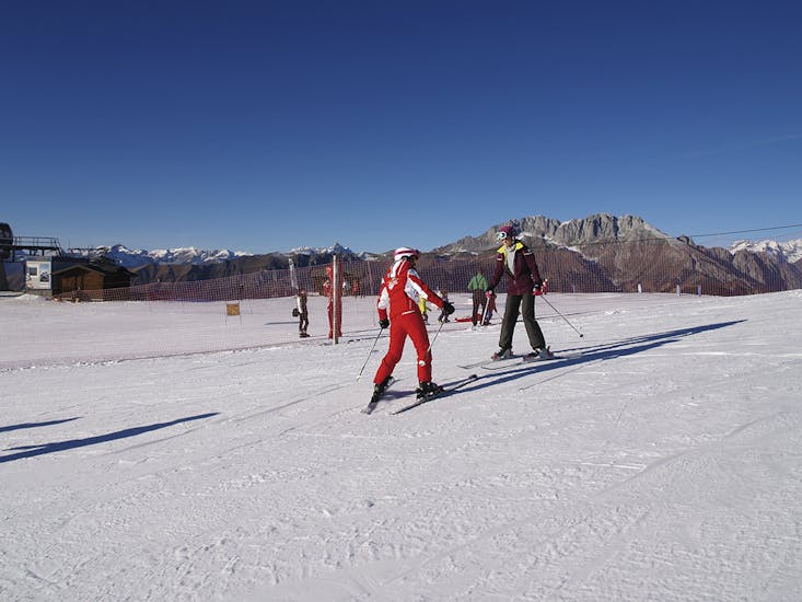 Participant taking part in one of the private ski lessons for adults of all levels.