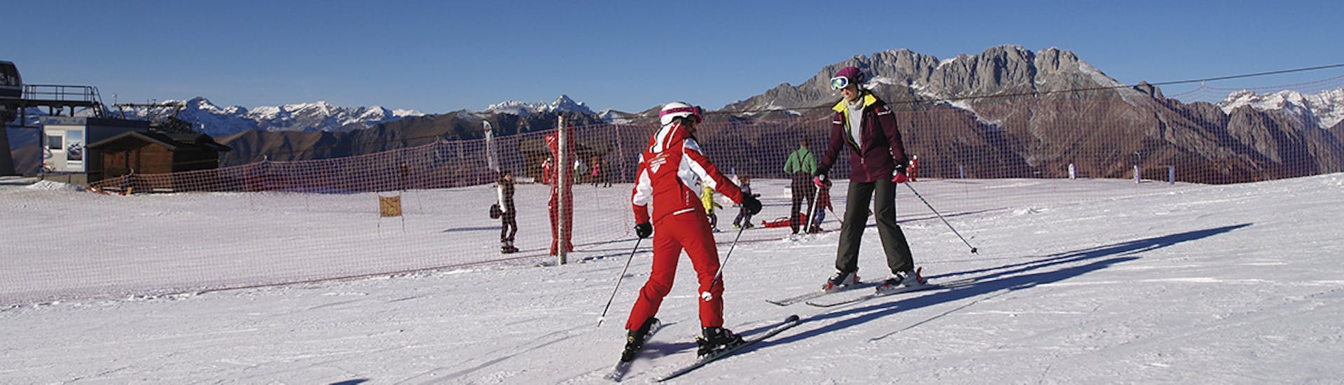 Participant taking part in one of the private ski lessons for adults of all levels.