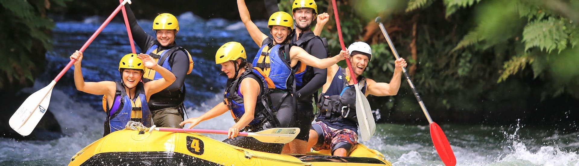 While Rafting on Kaituna River with pick-up in Rotorua, a group of friends is having a great time on the river with Rotorua Rafting.