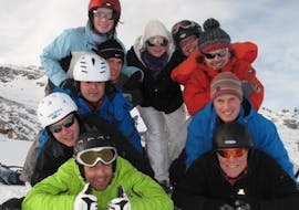 A family smiling in the camera during their Private Ski Lessons for Families of All Levels from Private Ski School Höll.