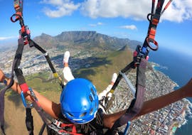 A person enjoys their Paragliding in Cape Town from Signal Hill or Lion's Head with Hi5 Tandem Paragliding Cape Town
