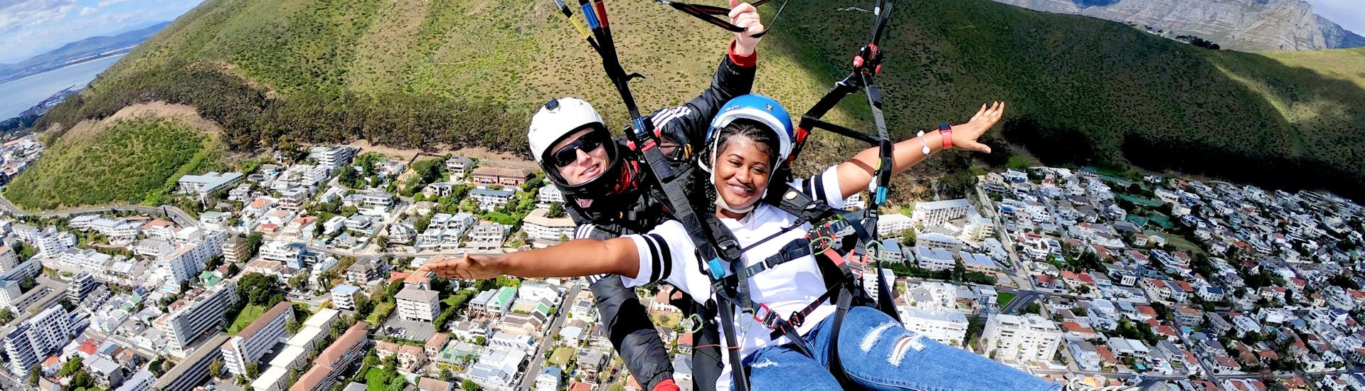A woman enjoys her Paragliding in Cape Town from Signal Hill or Lion's Head with Hi5 Tandem Paragliding Cape Town
