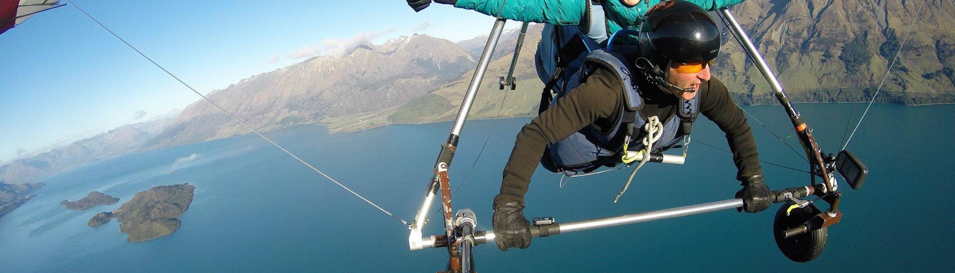 A hang gliding passenger is seemingly enjoying herself while Aerotow Hang Gliding in Queenstown with Skytrek Queenstown.