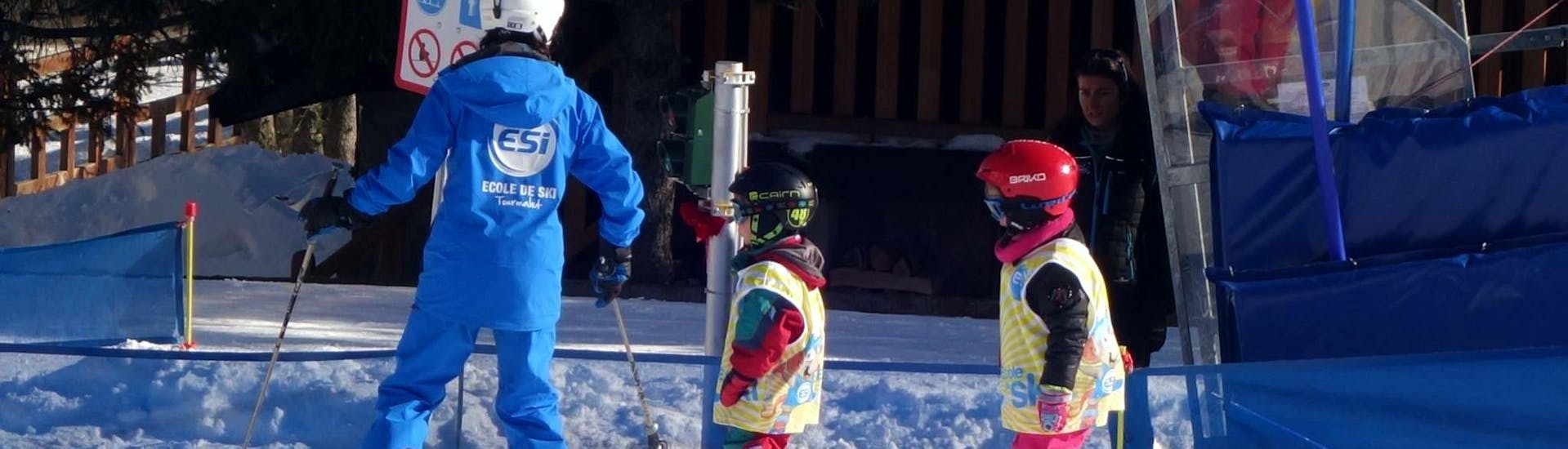 Young skiers are following their ski instructor from the ski school ESI du Tourmalet in La Mongie during their Kids Ski Lessons "Club Mont et Souris" (3-4 years) in the safety of the snowgarden.
