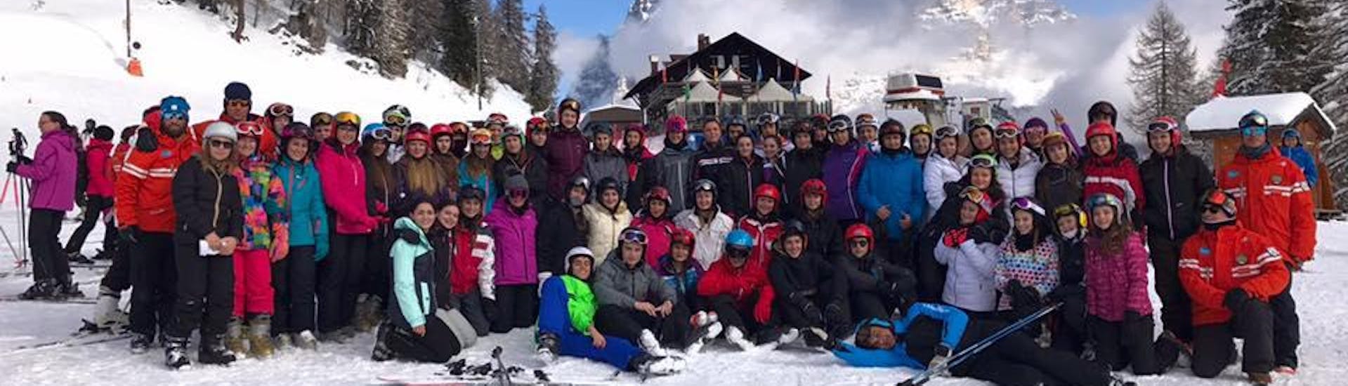The whole ski school takes a picture in Pecol after one of the Kids Ski Lessons (3-4 y.) for All Levels.