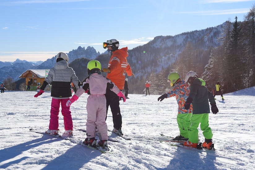 Kids during the Kids Ski Lessons (3-4 y.) for All Levels from Scuola Sci Civetta - Val di Zoldo Pecol.