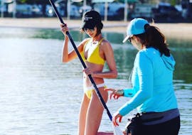 One of our guides instructing our guests on proper technique during the Stand up Paddle Boarding Paradise Tour in Gold Coast with Go Vertical SUP