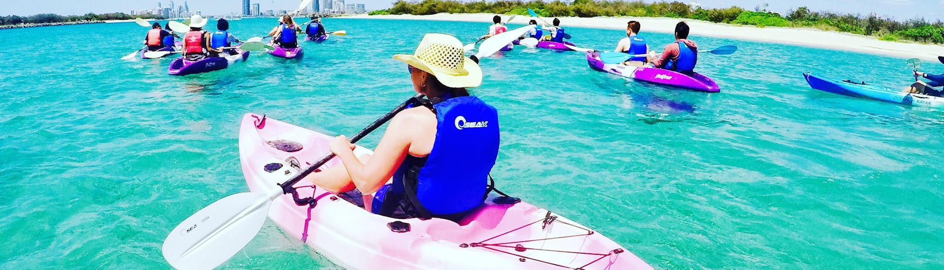 One of our guests paddling on the water during Sea Kayaking on the Gold Coast to Stradbroke Island with Australian Kayaking Adventure.