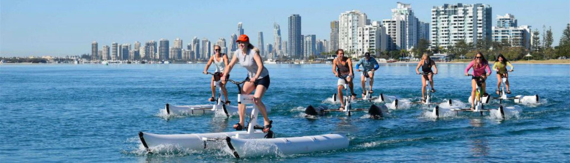 A group of people is pedalling across the broadwater during the Water Bike & Snorkeling in Gold Coast tour with Seaway Kayaking Tours.