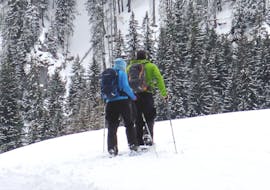 Under the guidance of an experienced guide from the ski school SnowMonkey, a couple is enjoying the Private Snowshoeing Tours - All Levels.
