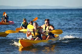 A young couple is all smiles during a tour by sea kayak from Noosa with Epic Ocean Adventures Noosa.
