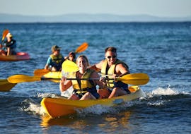 A young couple is all smiles during a tour by sea kayak from Noosa with Epic Ocean Adventures Noosa.