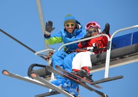 Ski instructor and kid during one of the private kid ski lessons for all levels in Campo Felice. 