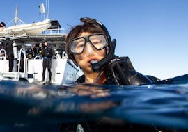 Under the supervision of an experienced dive instructor from Gold Coast Dive Centre, a tourist is enjoying the Discover Scuba Diving at Cook Island for Beginners.
