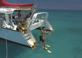During the Great Barrier Reef Snorkeling Trip from Cairns with Reef Daytripper Cairns, snorkelers are jumping into the clear, warm water to explore the underwater world of Upolu Reef.
