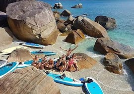 Our paddlers taking a break on Fitzroy Island during the Fitzroy Island Stand Up Paddling Tour from Cairns with What'SUP Cairns.