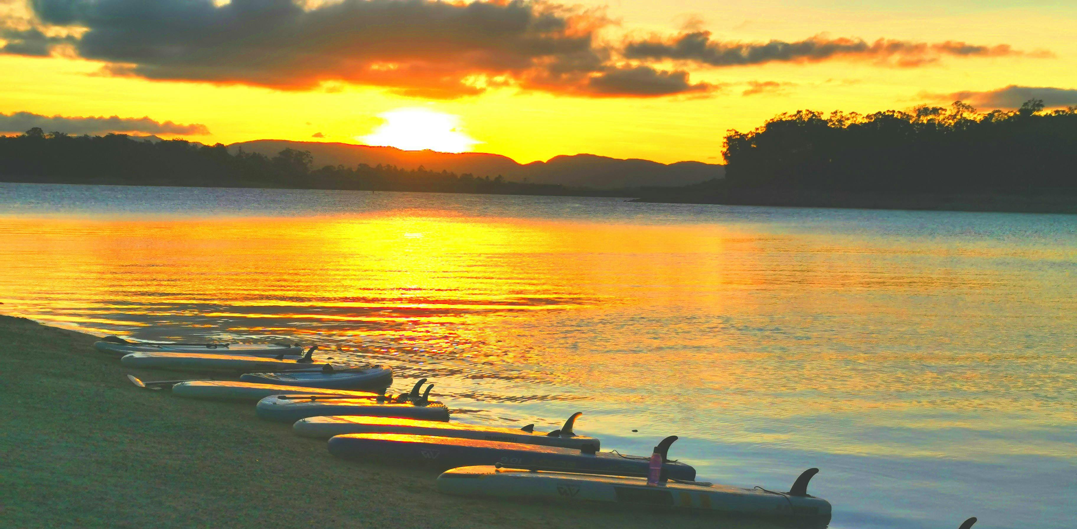 Our paddlers taking a break on Fitzroy Island during the Fitzroy Island Stand Up Paddling Tour from Cairns with What'SUP Cairns.