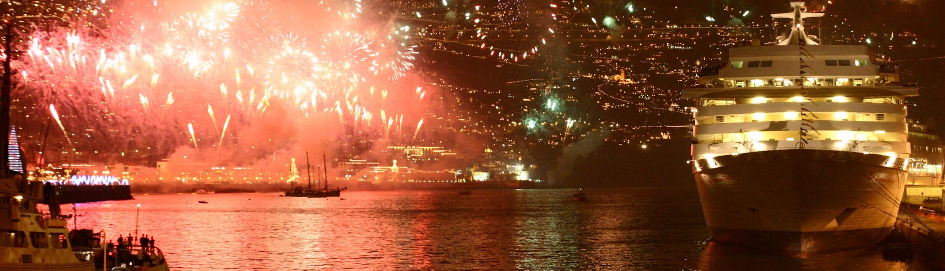 Fireworks going off infront of the new years eve catamaran tour provided by VMT Madeira.
