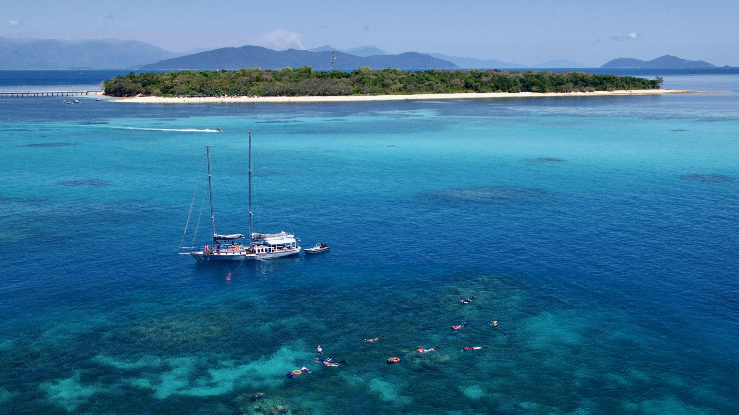 An image of the Ocean Free sailing schooner anchored in the sea during the Great Barrier Reef Snorkeling Boat Trip.
