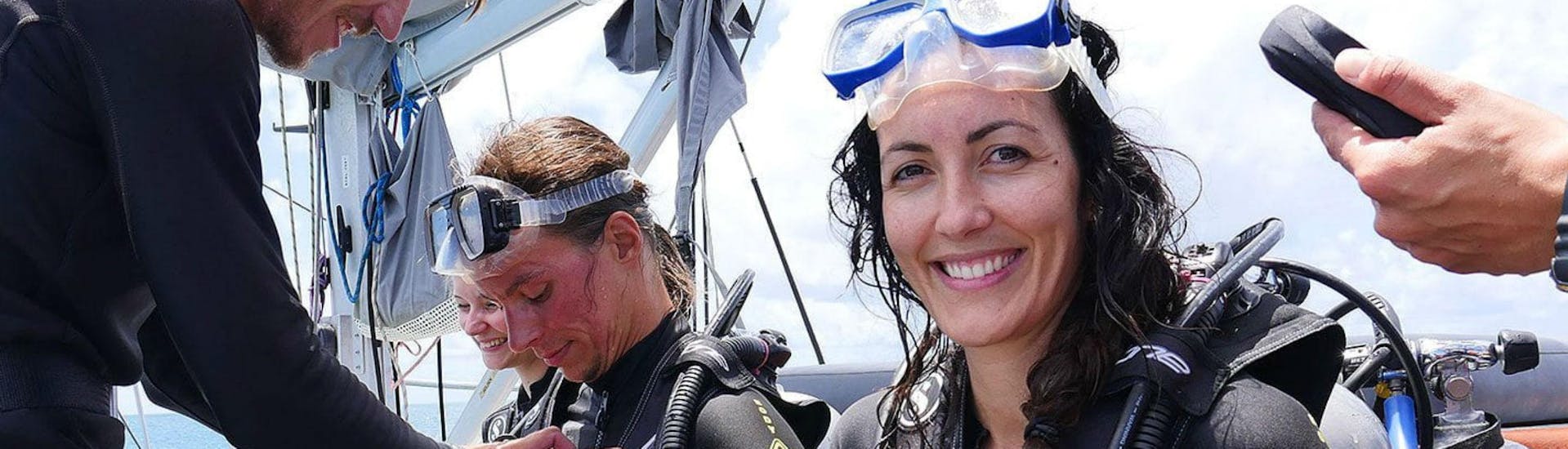 A group of scuba divers is preparing to get into the water for some Beginners' Scuba Diving at the Great Barrier Reef with Ocean Free.