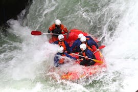 The tour participants have fun in a water vortex during the rotorua rafting waterfall experience - winter with River Rats Rotorua Raft & Kayak. 