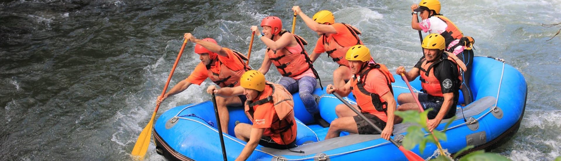 During Rangitaiki River Rafting in Murupara with Rafting Adventure Rotorua, the participants are paddling together in order to overcome any obstacles on the river.
