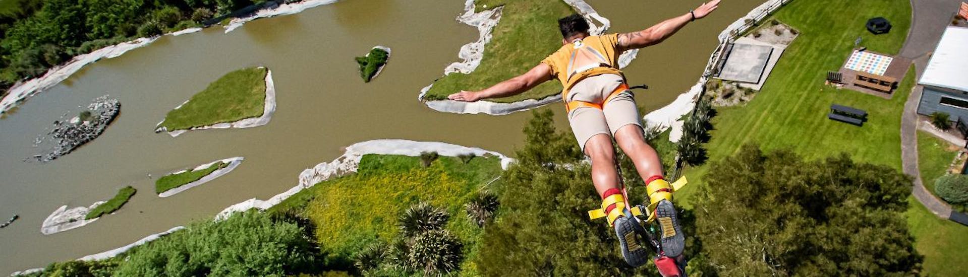 In Velocity Valley Rotorua Adventure Park, a guy took a leap of faith to jump off the 43m high tower and is hurling to the grounds during the Bungy Jump in Rotorua. 