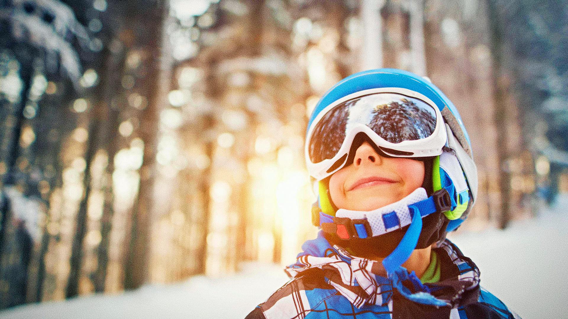 A participant of the Kids Ski Lessons (5-12 years) - All Levels with BigFutz Snow Sports School Zermatt is having fun in a snowy forest of Zermatt.