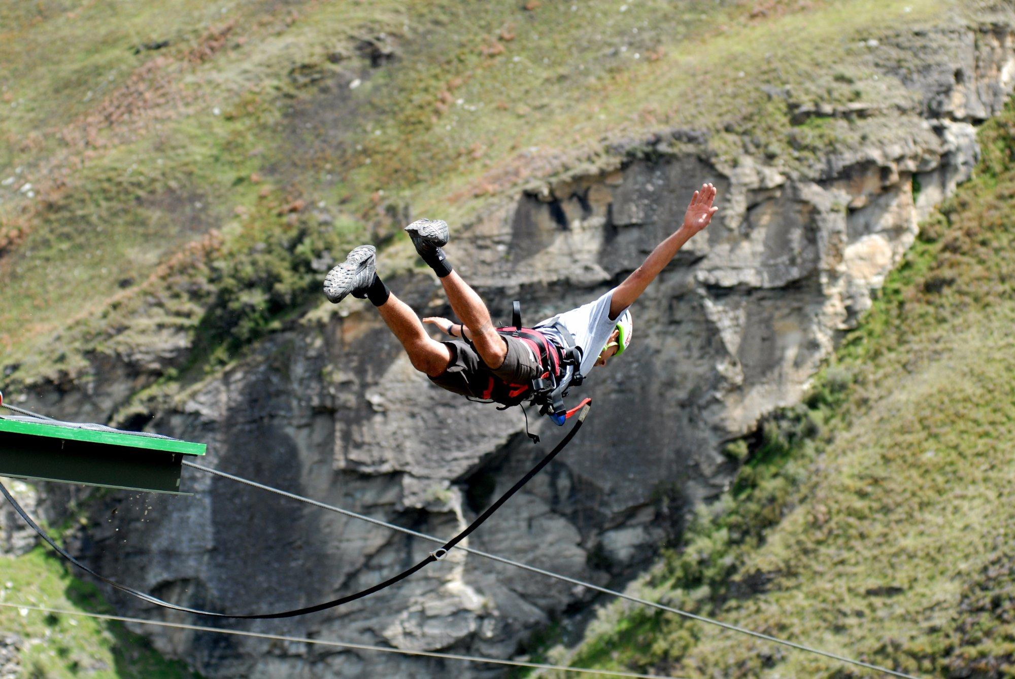 A brave participant is jumping into the Shotover Canyon Zipline in Queenstown which is operated by Shotover Canyon Swing & Fox Queenstown.