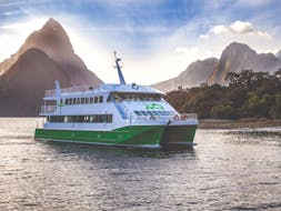 A catamaran is heading to beautiful waterfalls and rainforest during the Milford Sound Cruise "Classic" - Winter organised by Jucy Cruise.