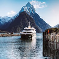The modern catamaran is going through a passage during the Milford Sound Cruise "Premium" - Winter organised by Jucy Cruise.