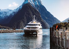 The modern catamaran is going through a passage during the Milford Sound Cruise "Premium" - Winter organised by Jucy Cruise.