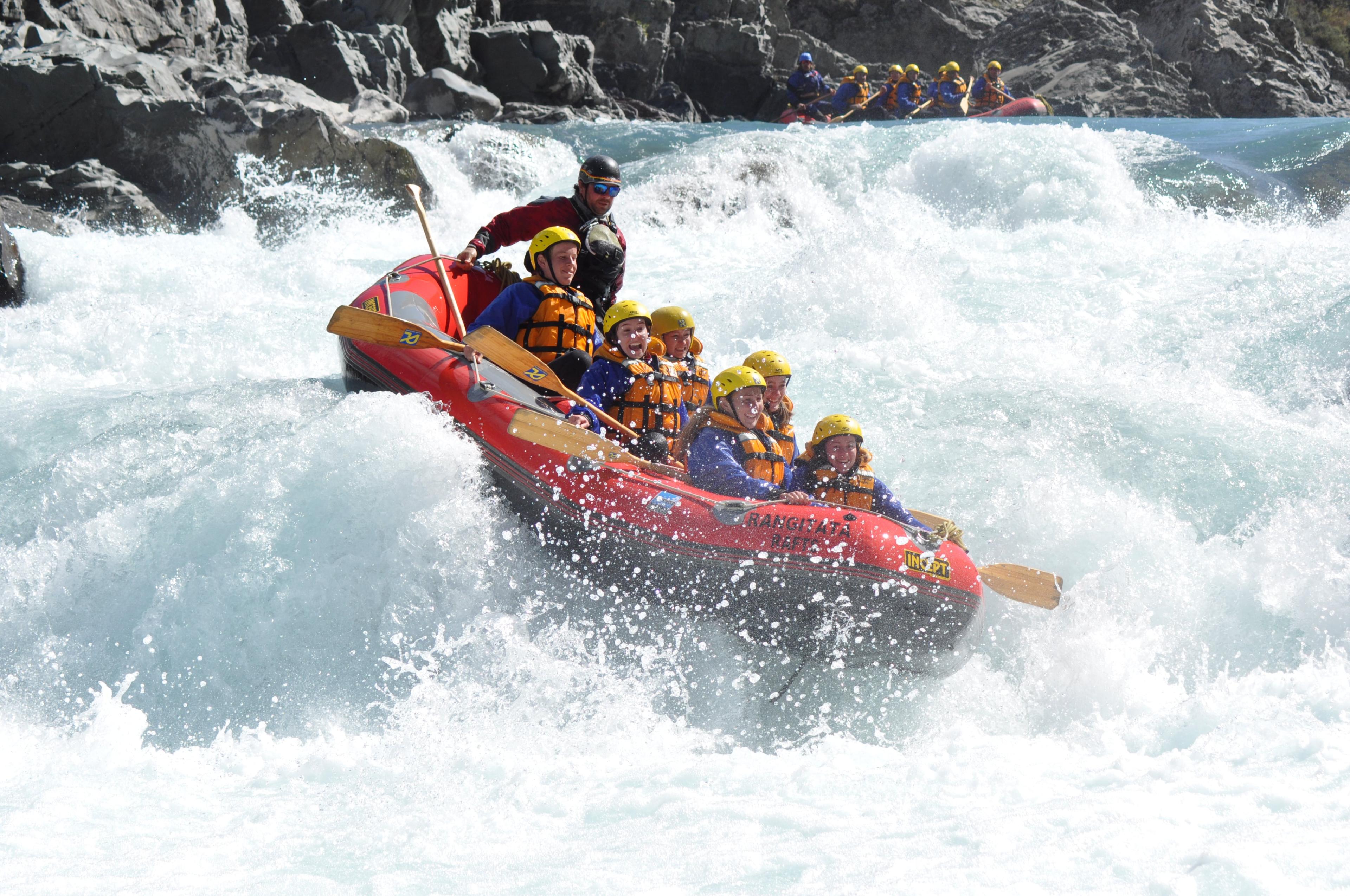 The participants of Rangitata Gorge Rafting with Christchurch transfer organized by Rangitata Rafts are facing a thunderous grade 5 rapid on the river.