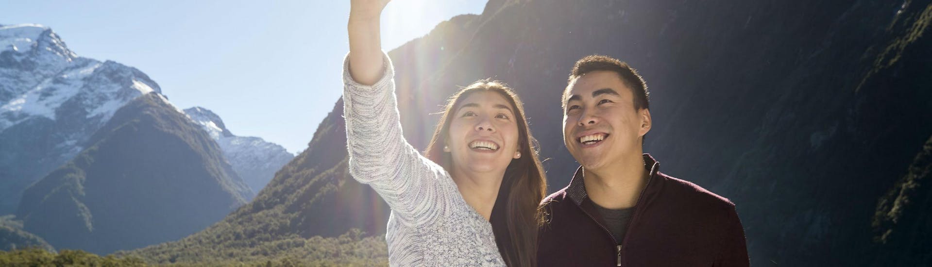 A couple can be seen taking a selfie during the Scenic Cruise in Milford Sound organised by Southern Discoveries.