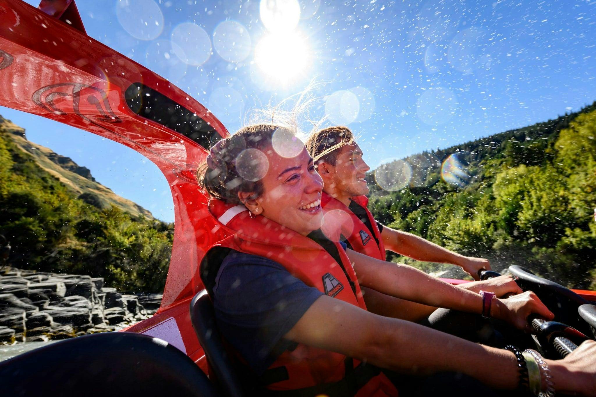Participants of the Queenstown Jet Boat Tour to Shotover Canyon & 4x4 Experience organized by Shotover Jet Queenstown have fun on the boat.