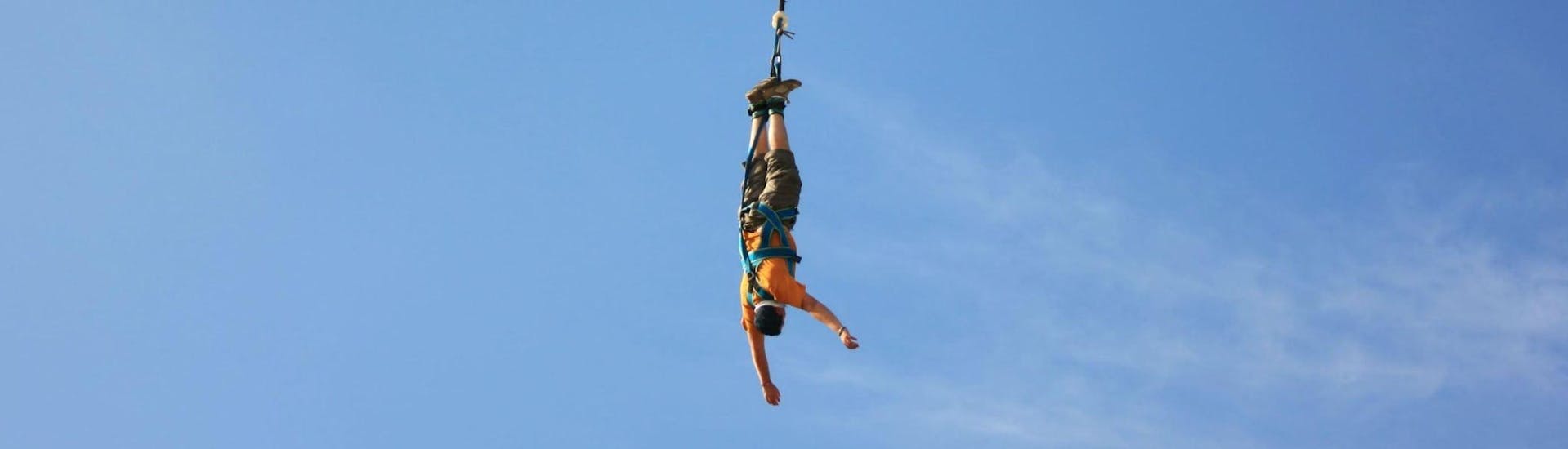 A person is participating to the Bungee Jumping from Viaduc de Coquilleau (52m) activity with Elastic Crocodil Bungee.