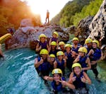 A group of families having fun while Rafting on the Soča River with A2 Rafting Kobarid.
