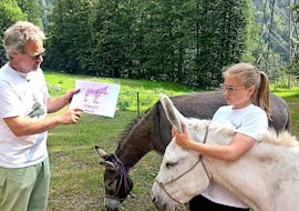 Mario tells a little girl everything about Donkeys during the Canyoning in the Sorba with BBQ&Donkey Activity with Monterosa Canyoning.