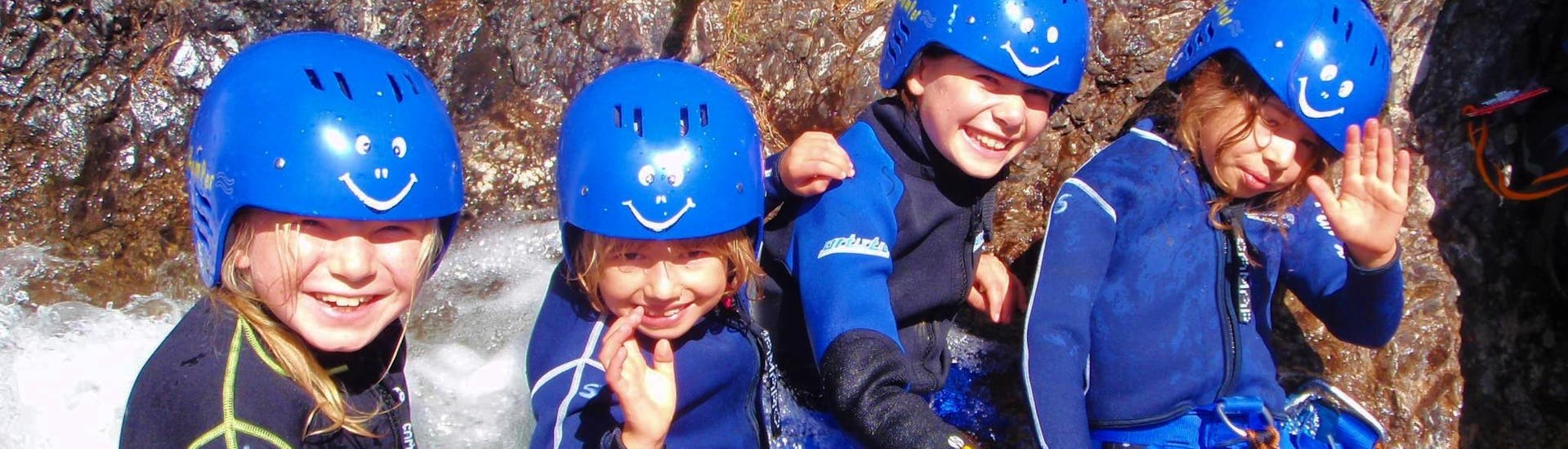 Four young kids are having fun during the Family Canyoning in the Lechtal Valley organized by Fun Rafting Lechtal.
