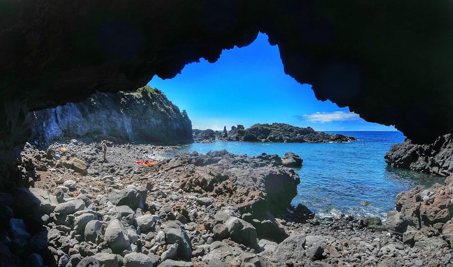 View on a rocky beach from a cave during the Sea Kayaking to Vila Franco do Campo Islet with Fun Activities Azores Adventures.