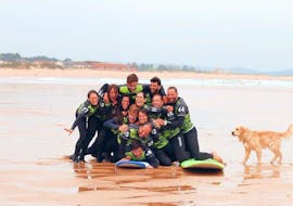 A group of surfers throw themselves together for a great group photo for Latas Surf during their Surfing Lessons incl. video analysis - All Levels & Ages.