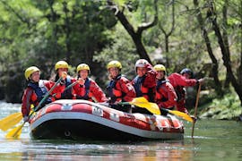 The participants of the Class II Rafting on Rio Paiva in Arouca Geopark	with Clube do Paiva are enjoying the calm waters of the river as they raft through the stunning natural scenery.