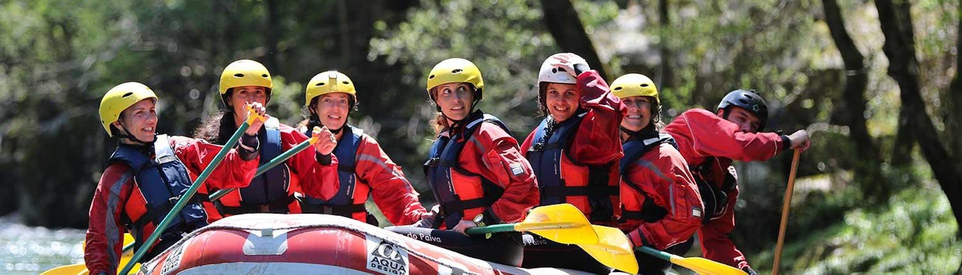 The participants of the Class II Rafting on Rio Paiva in Arouca Geopark	with Clube do Paiva are enjoying the calm waters of the river as they raft through the stunning natural scenery.