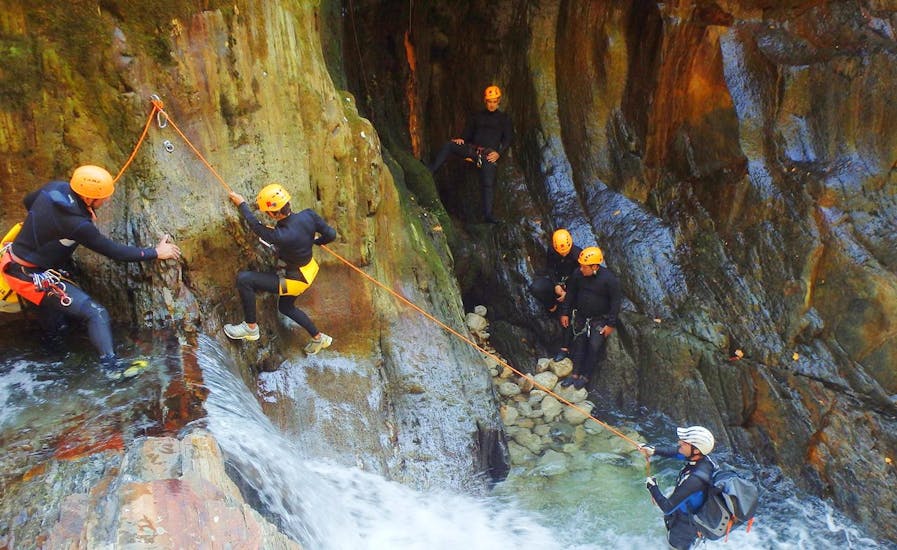 People smiling at the camera during the Canyoning at Rio Frades in Arouca Geopark.