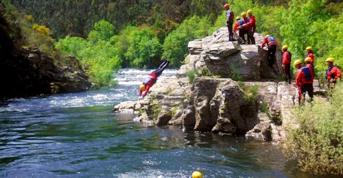 Easy River Trekking in Rio Paiva in Arouca Geopark with Clube do Paiva Arouca A participant of the Easy River Trekking in Rio Paiva in Arouca Geopark with Clube do Paiva is cliffjumping into the cool water of the river.