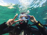 A diver is happy to do Trial Scuba Diving in Calanques National Park from Marseille with Le Bateau Jaune.