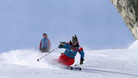 Two skiers riding down the slope during their private lessons for adults of all levels with Heli's skischule Saalbach-Hinterglemm.