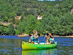 A girl is paddling with her boyfriend on the Dordogne river during the route  from La Roque-Gageac 9km of Canoe Dordogne.