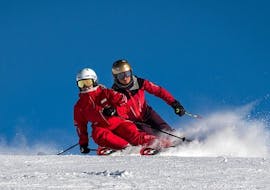 Two skiers race down the slopes during their private ski lessons - Lauberhorn Challenge with the Grindelwald Ski School