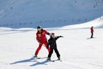 A child has lot of fun with its private skiing instructor during a private ski lesson for kids of all levels in Bad Kleinkirchheim.